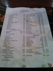 A whisky menu, tattered and stained from being enthusiastically passed from hand to hand.