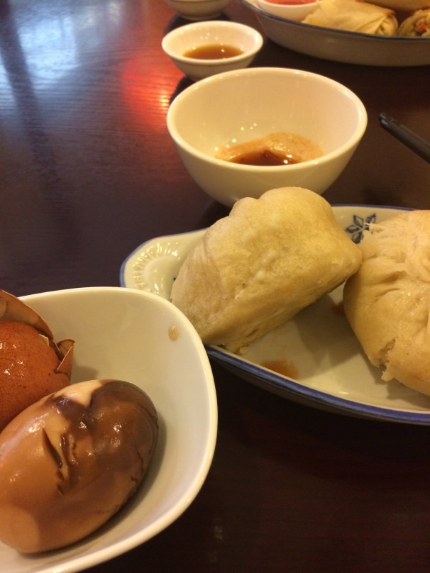 Dumplings and an egg steeped in black tea. Yum.