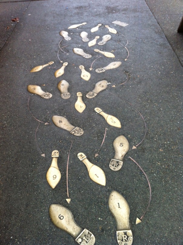 Dance steps in the sidewalk that did not lead to the dumpster in question. Or maybe, confusingly, they did.